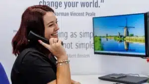 Accountant from Modus accountants talking on the phone with a business client.