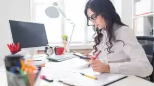 Accountant working on paperwork in the office.