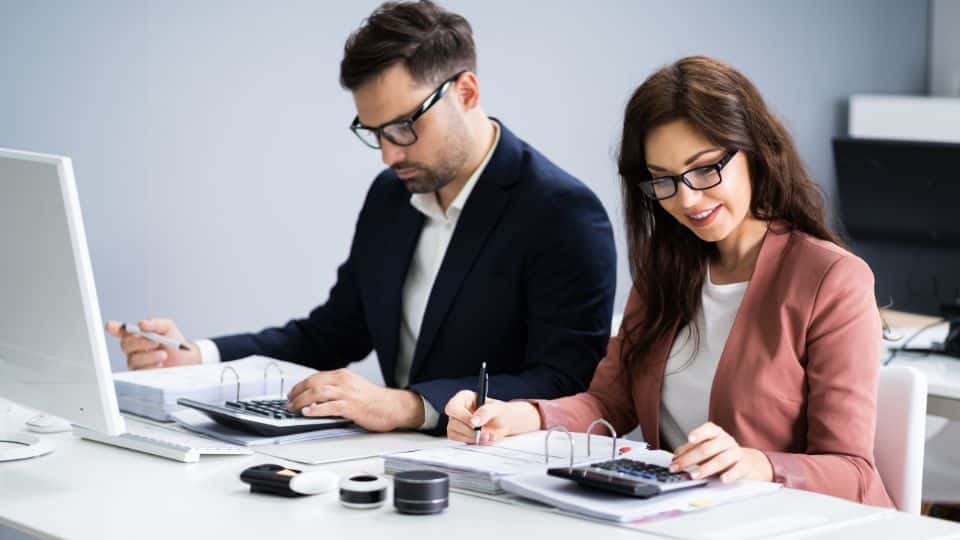 Accountants in the office planning taxes for a client.